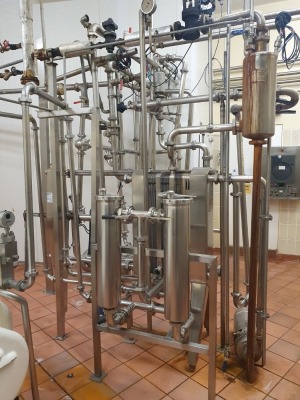 1500Ltr/Hr Pasteuriser comprising - APV type 85D Heat Exchanger with 3 Grids and Approximately 54 Plates, APV "A" type Hot Water Set, APV 1.5-2 7 Puma Pump, APV 2-3-9 Puma Pump, Balance Tank, Interconnecting Pipework Valves and Controls